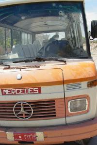 Bullets riddled the bus windshield.